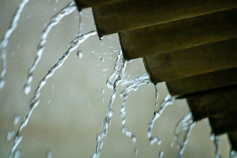 Water pouring from a pipe during a plumbing failure